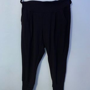 Black jogger sweatpants. Has front pockets.